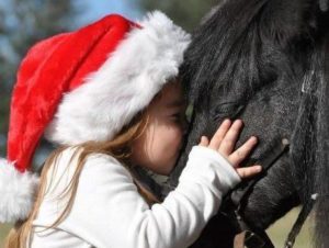 little girl and horse Christmas